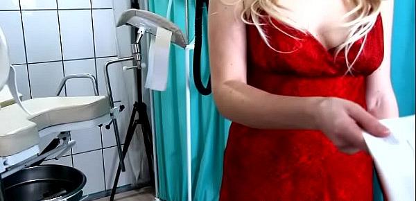  Woman in red examined by a gynecologist